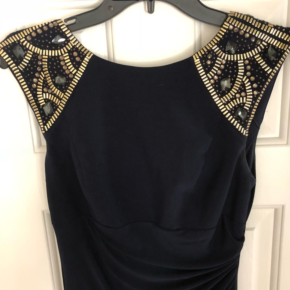 Navy, embellished cap sleeve, form fitted gown